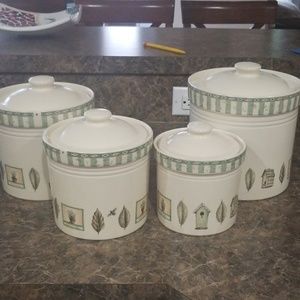 Four naturewood canisters is sold